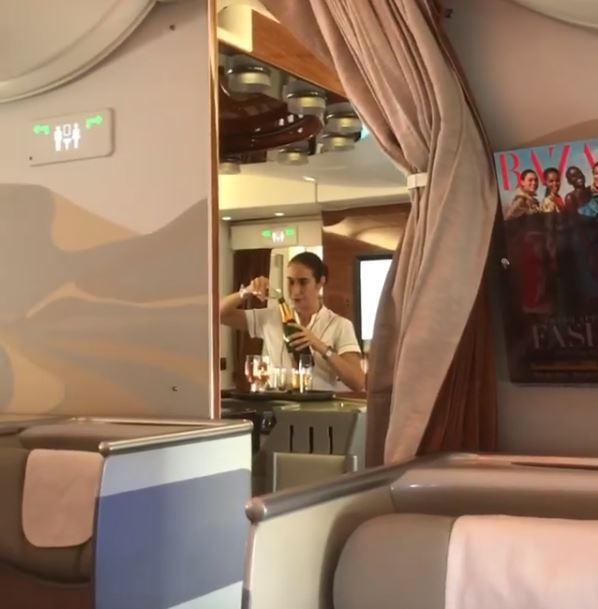 Emirates Airline, Airhostess pour back unused champagne, Emirates Airhostess, Private Airlines